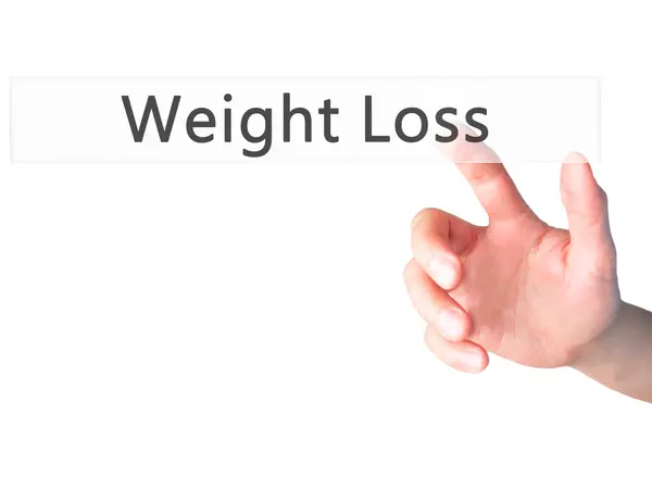 Gewichtsverlust - Hand drückt eine Taste auf verschwommenem Hintergrund — Stockfoto