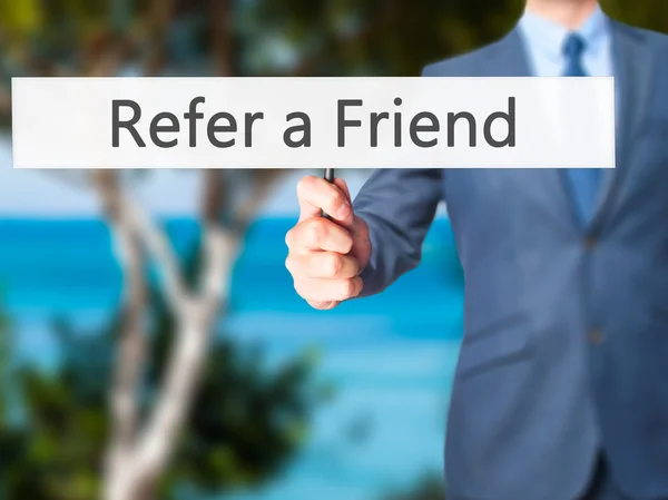 Refer a Friend - Business man showing sign — Stock Photo, Image
