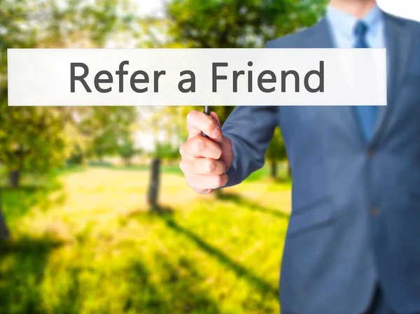 Refer a Friend - Business man showing sign — Stock Photo, Image