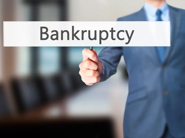 Bankruptcy - Business man showing sign — Stock Photo, Image