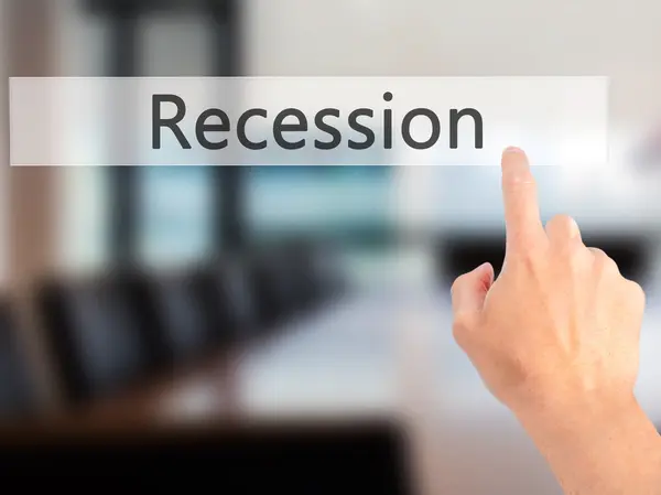 Recession - Hand pressing a button on blurred background concept — Stock Photo, Image