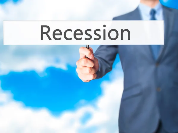 Recession - Business man showing sign — Stock Photo, Image