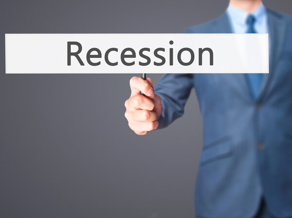 Recession - Business man showing sign