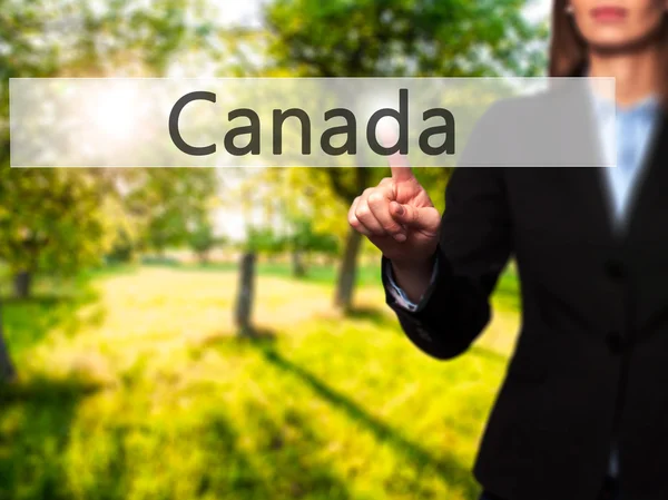 Canadá - Mano femenina aislada tocando o señalando el botón — Foto de Stock
