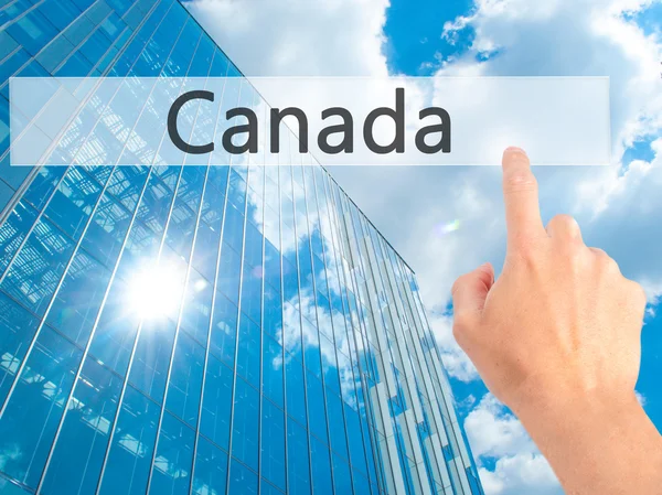 Καναδάς - χέρι πατώντας ένα κουμπί στην έννοια θολή φόντο — Φωτογραφία Αρχείου