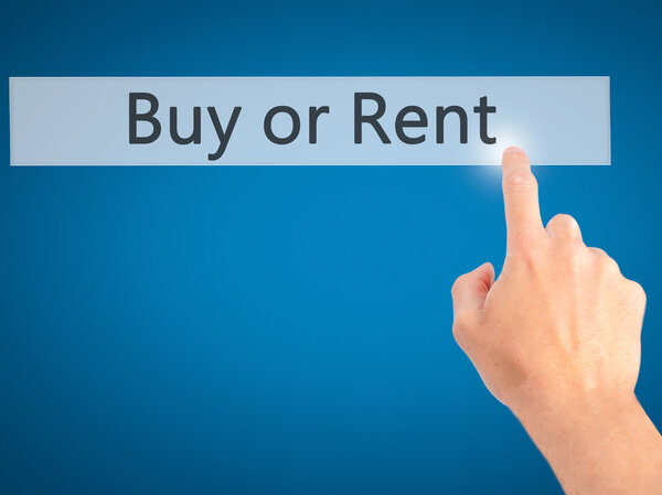 Buy or Rent - Hand pressing a button on blurred background conce