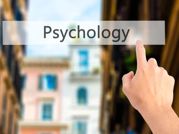 Psychology - Hand pressing a button on blurred background concep — Stock Photo, Image