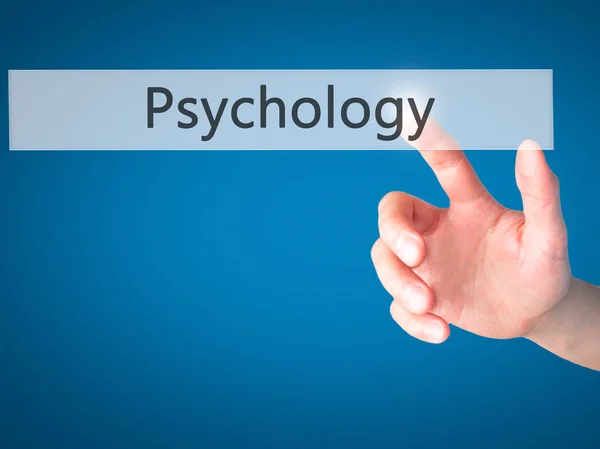 Psychology - Hand pressing a button on blurred background concep — Stock Photo, Image