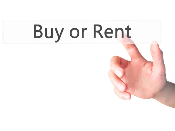 Buy or Rent - Hand pressing a button on blurred background conce — Stock Photo, Image