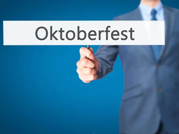 Oktoberfest - Forretningsmand hånd holder tegn - Stock-foto