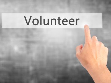 Gönüllü - Bulanık arka plan konseptinde düğmeye basarak el