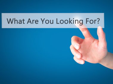 What Are You Looking For ? - Hand pressing a button on blurred b