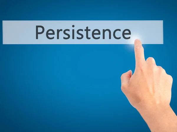 Persistentie-hand indrukken van een knop op onscherpe achtergrond conce — Stockfoto