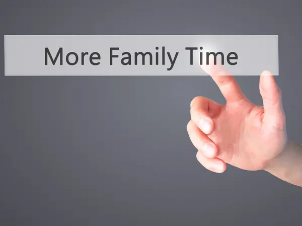 More Family Time - Hand pressing a button on blurred background — Stock Photo, Image