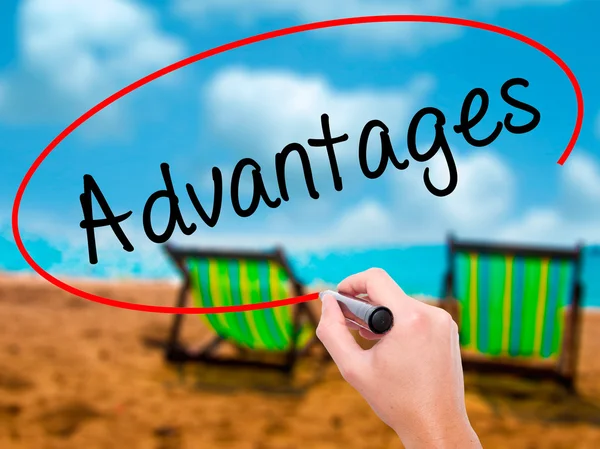 Man Hand writing Advantages with black marker on visual screen — Stock Photo, Image