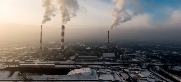Aerial view of Industrial zone, plants and factories with smoke from chimneys. Air pollution concept. Panorama