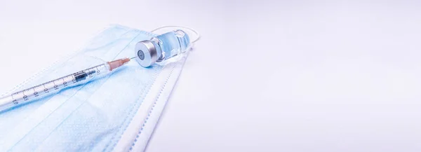 Medicine bottle for injection. Medical glass vials and syringe for vaccination. liquid drug or vaccine for treatment, flu in laboratory, hospital or pharmacy concept isolated on white background. Copy Space