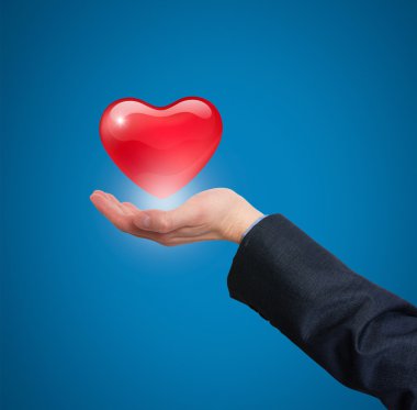 Kalp holding, iş sağlık temsil eden el.