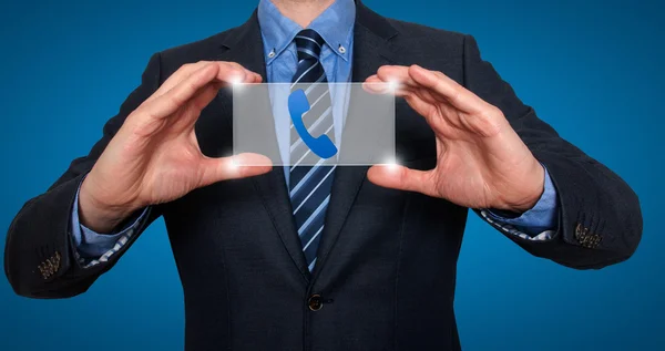 Telefono e contatto simboli di fronte a uomo d'affari - Immagine Stock — Foto Stock