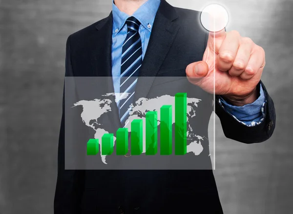 Businessman in dark suit pushing button worldmap global Growth. Green graph on world map. — Stock Photo, Image