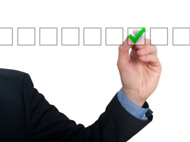 Businessman ticks off in in a square. Task list concept. Isolated on grey background.