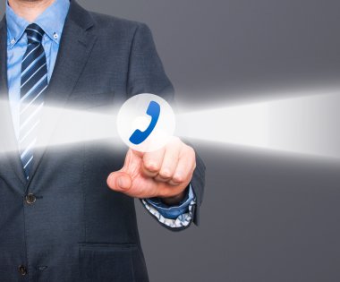 Businessman pressing phone button on visual screen. Customer support concept.  Stock Image