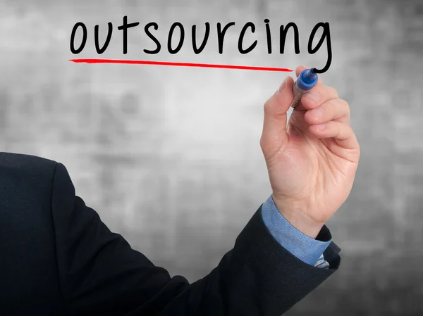 Businessman hand writing Outsourcing. Business concept.Stock Photo — Stockfoto