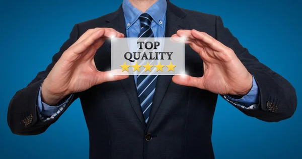 TOP Quality with five stars - Businessman with sign - Isolated on various background - Stock Photo — Stock Photo, Image