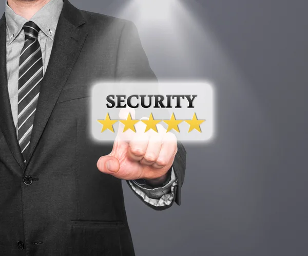 Internet security online business concept businessman pointing five stars security services. Isolated on office background. Stock Image — стокове фото