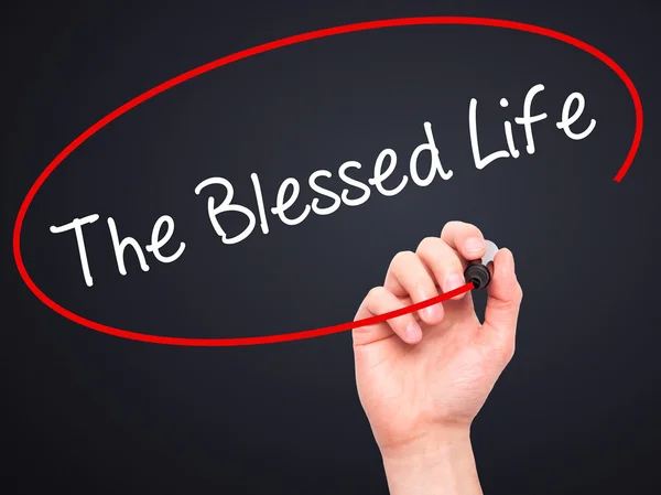 Man Hand writing The Blessed Life  with black marker on visual s — Stock Photo, Image