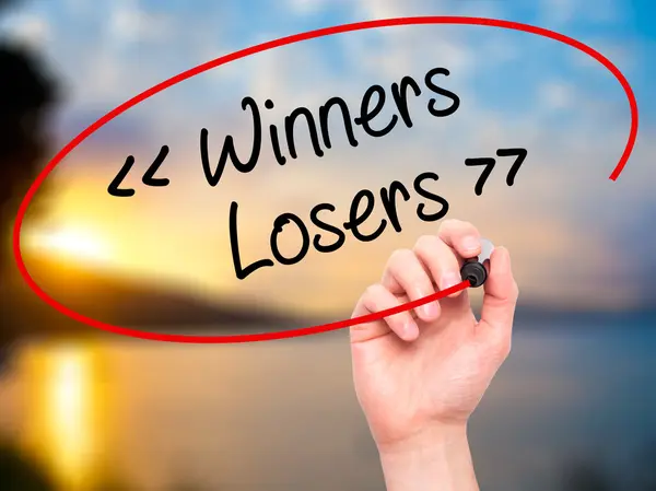 Man Hand writing Winners - Losers  with black marker on visual s — Stock Photo, Image