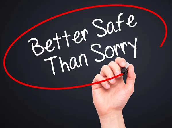 Man Hand writing Better Safe Than Sorry with black marker on vis — Stock Photo, Image