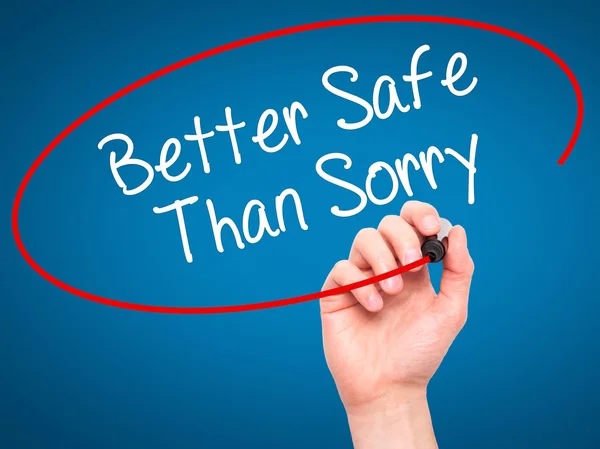 Man Hand writing Better Safe Than Sorry with black marker on vis — Stock Photo, Image