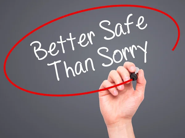 Man Hand writing Better Safe Than Sorry with black marker on vis — Stock Photo, Image