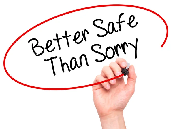 Man Hand writing Better Safe Than Sorry with black marker on vis — Stock Photo, Image