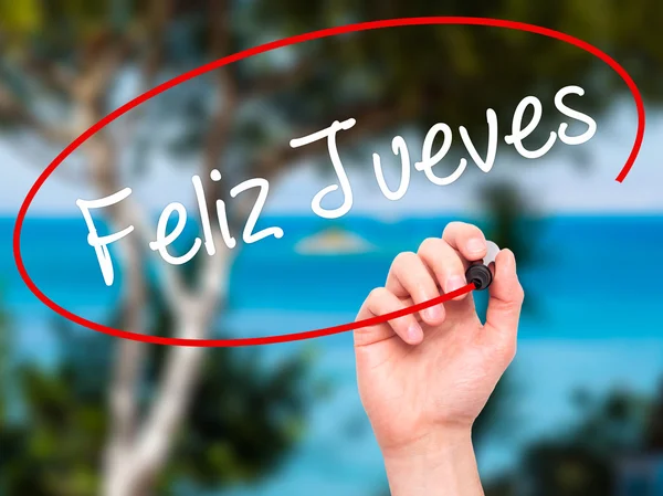 Člověk ruku psaní Feliz Jueves (Happy čtvrtek ve španělštině) s b — Stock fotografie