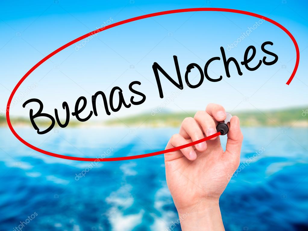 Man Hand writing Buenas Noches (Good Night In Spanish) with blac