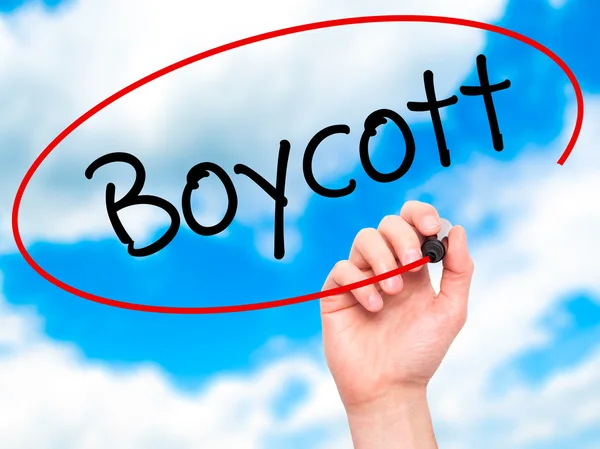 Man Hand writing Boycott with black marker on visual screen. — Stock Photo, Image