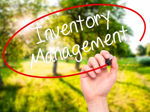 Man Hand writing Inventory Management with black marker on visua — Stock Photo, Image