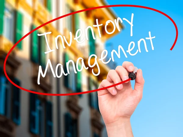 Man Hand writing Inventory Management with black marker on visua — Stock Photo, Image