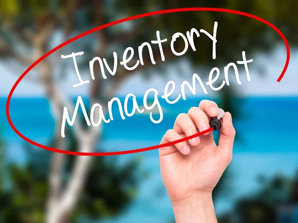 Man Hand writing Inventory Management with black marker on visua — Stock Photo, Image