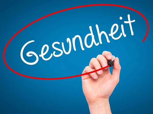 Man Hand writing Gesundheit (Health in German)  with black marke — Stock Photo, Image