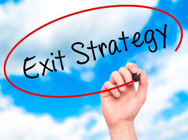 Man Hand writing Exit Strategy with black marker on visual scree