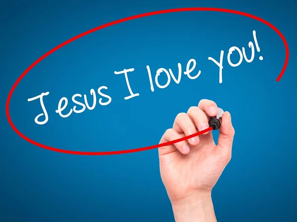 Man Hand skriva Jesus älskar jag dig! med svart markering på visuella s — Stockfoto