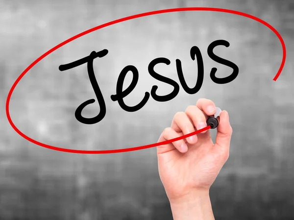 Man Hand schrijven van Jesus met zwarte marker op visuele scherm — Stockfoto