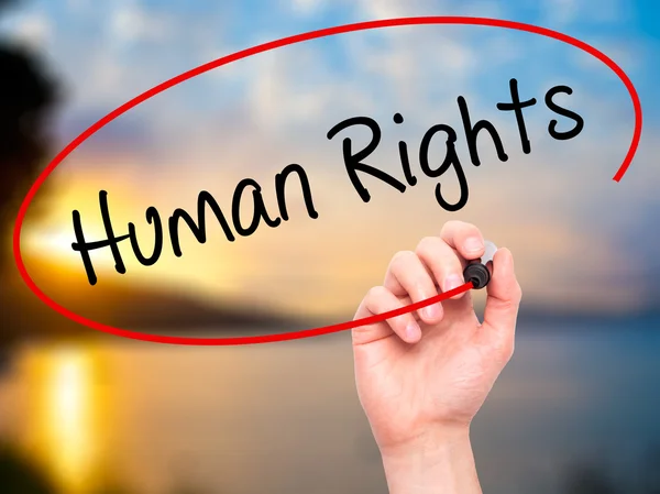 Man Hand writing Human Rights with black marker on visual screen — Stock Photo, Image