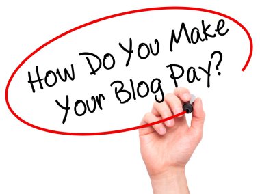 Man Hand writing How Do You Make Your Blog Pay? with black marke