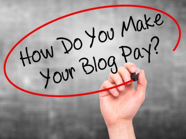 Man Hand writing How Do You Make Your Blog Pay? with black marke