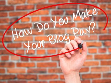 Man Hand writing How Do You Make Your Blog Pay? with black marke