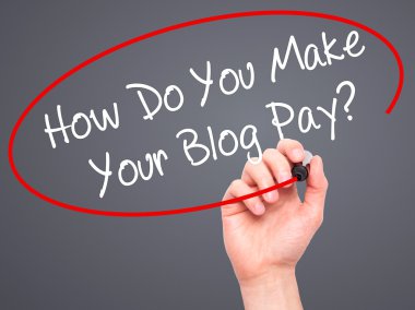 Man Hand writing How Do You Make Your Blog Pay? with black marke